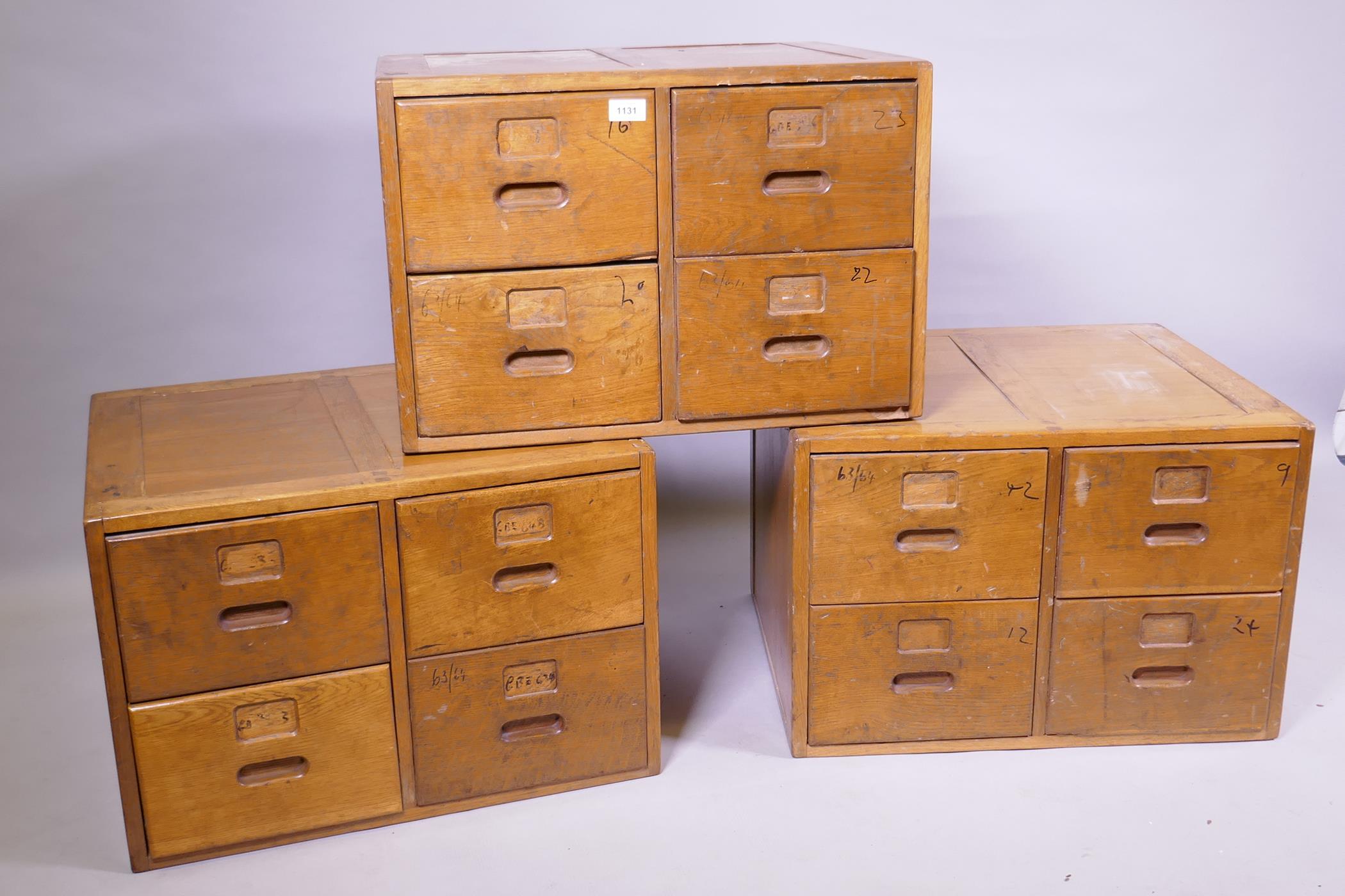 Three oak four drawer filing cabinets/haberdasher's cabinets, 60 x 51cm, 40cm high