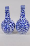 A pair of Chinese blue and white bottle vases decorated with dragons amongst foliage, KangXi 4