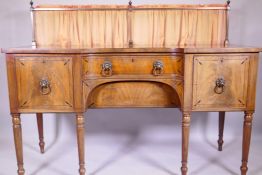 George III faded mahogany inverted breakfront sideboard, with ebony inlaid decoration, brass