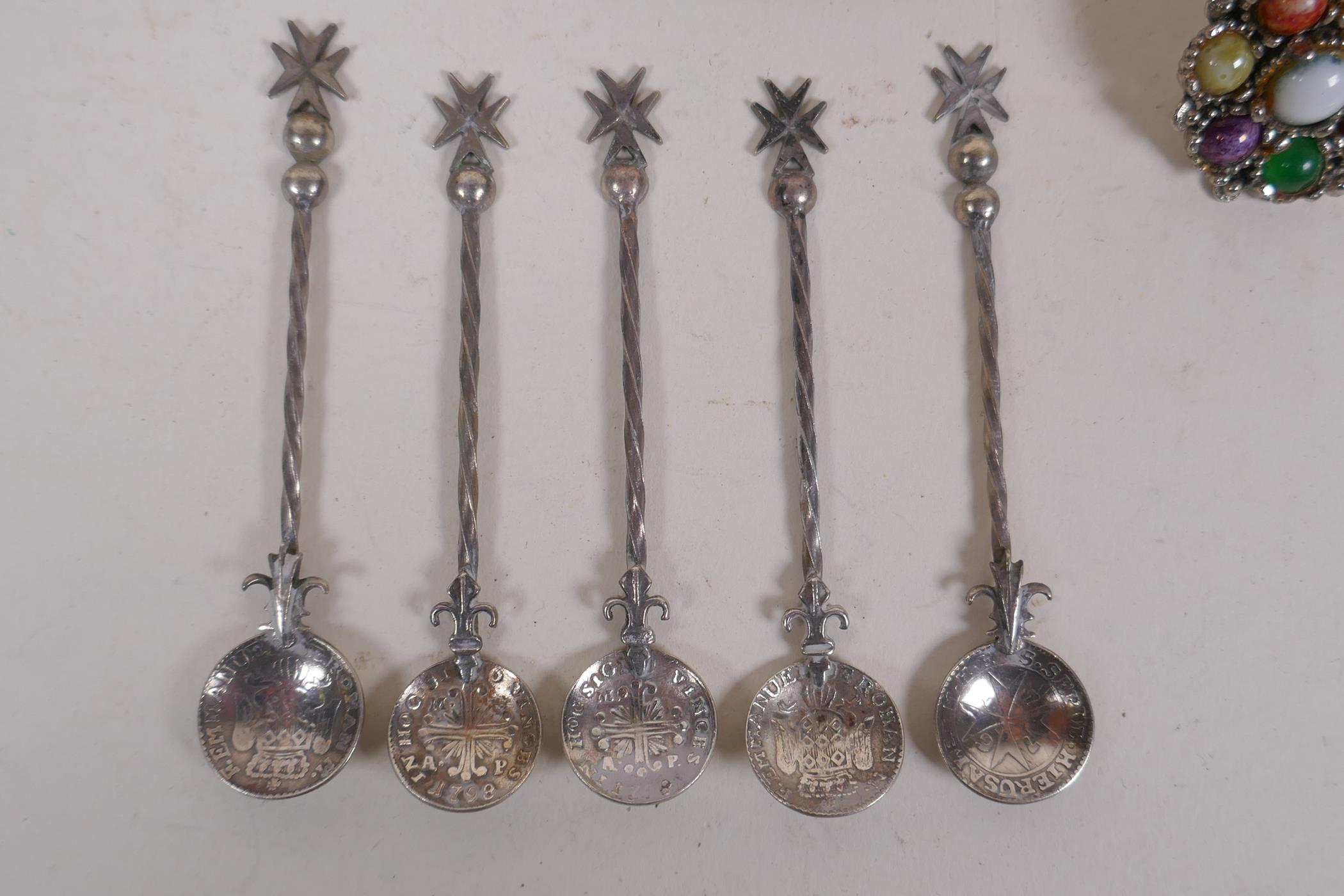 A collection of silver, silver plate and white metal items to include tea spoons, coin spoons, - Image 6 of 9