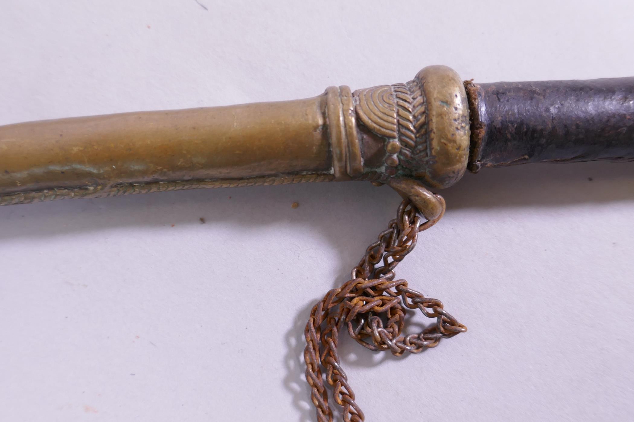An antique Eastern bras opium pipe with stitched leather shaft, 33cm long - Image 3 of 4