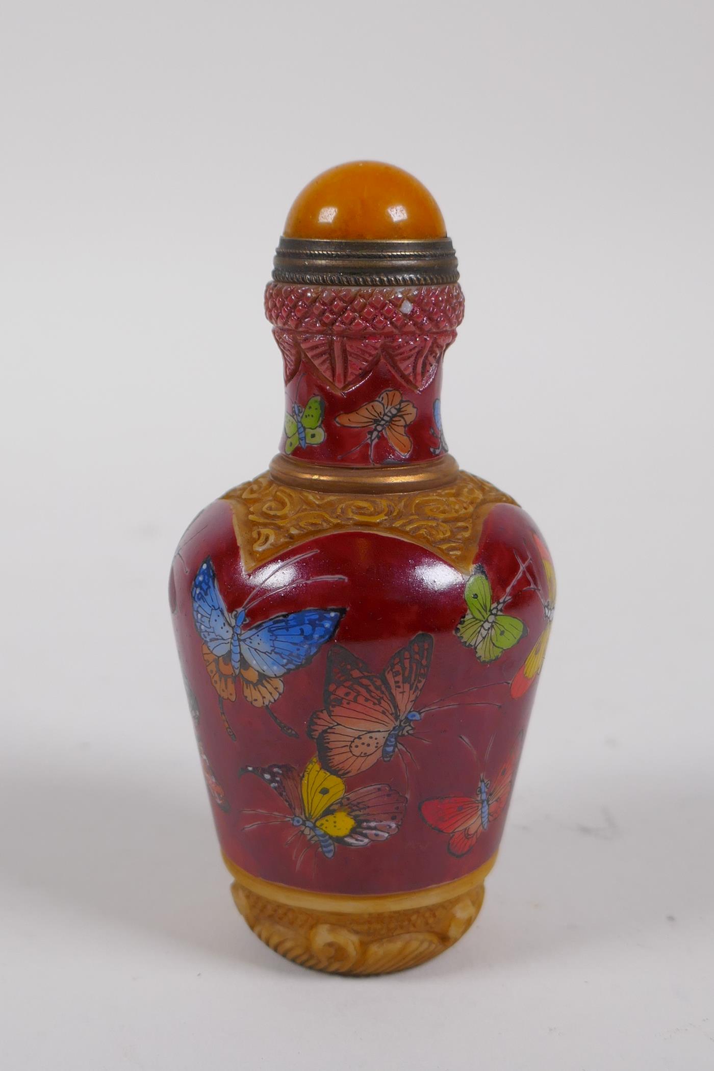 A Chinese moulded glass snuff bottle with enamelled butterfly decoration, 4 character mark to - Image 3 of 4