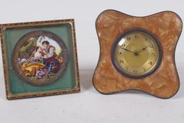 Two small bedroom clocks, one dial decorated with a romantic scene