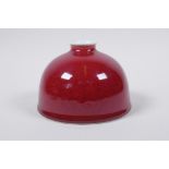 A sang de boeuf glazed porcelain water pot, Chinese Kang Xi 6 character mark to base, 13cm diameter