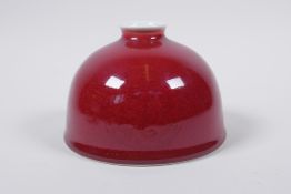 A sang de boeuf glazed porcelain water pot, Chinese Kang Xi 6 character mark to base, 13cm diameter