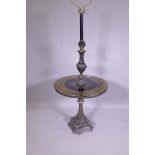 A 'Hollywood Regency' metal floor lamp with glass top table, decorated with a parcel gilt and