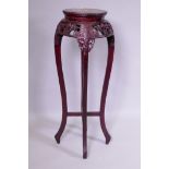 A Chinese jardiniere stand with carved and pierced frieze and inset marble top, 36cm diameter x 90cm