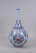 A Doucai porcelain bottle vase with decorative floral panels, Chinese Qianlong seal mark to base,