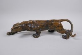 A filled bronze figure of a panther, 37cm long