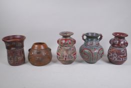 Five South American terracotta vases, with stylised figural designs, largest 19cm high