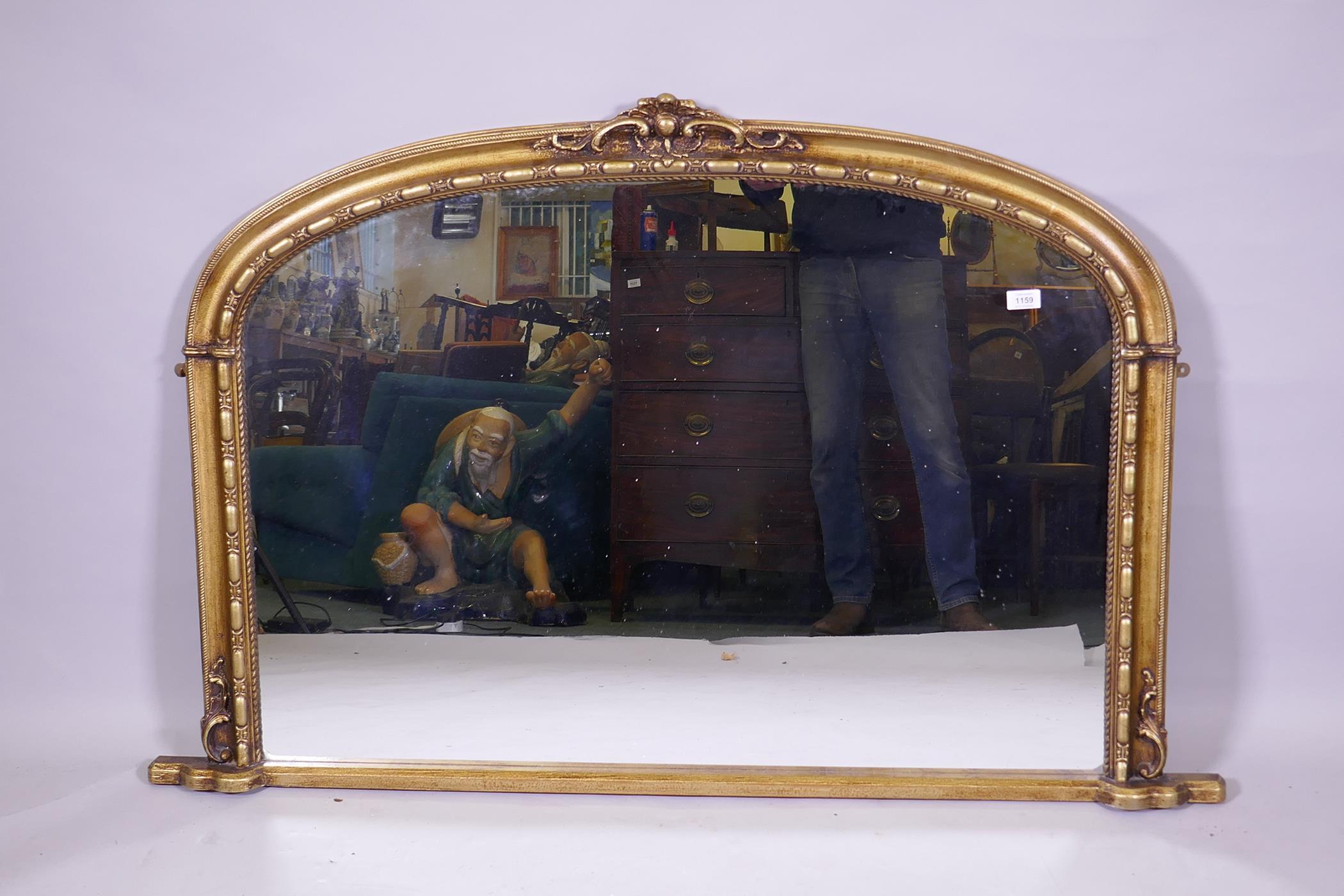 A Victorian style gilt overmantel mirror, 138 x 88cm