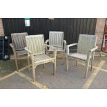 Four teak garden chairs