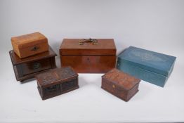 An C18th/C19th mahogany tea caddy, and armorial leather box and a collection of four others, largest