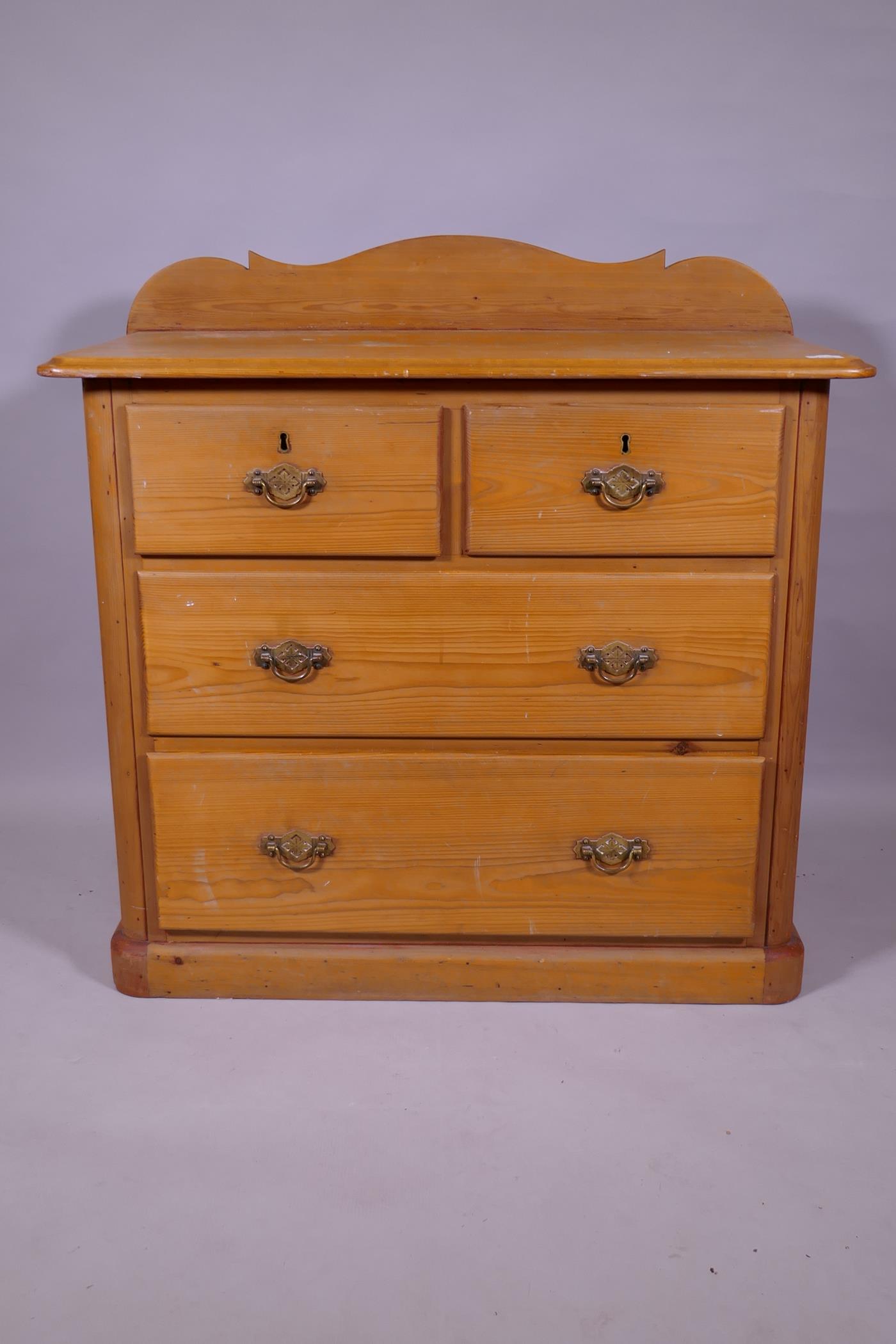 An Edwardian pine chest of two over two drawers, raised on a plinth base, 93 x 49 x 90cm