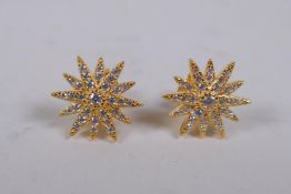 A pair of silver gilt and cubic zirconia set sunburst stud earrings