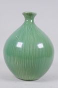 An oriental melon glazed bulbous vase, 26cm high
