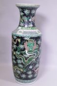 A Chinese KangXi style famille vert glazed floor vase decorated with dragons, KangXi mark to side,