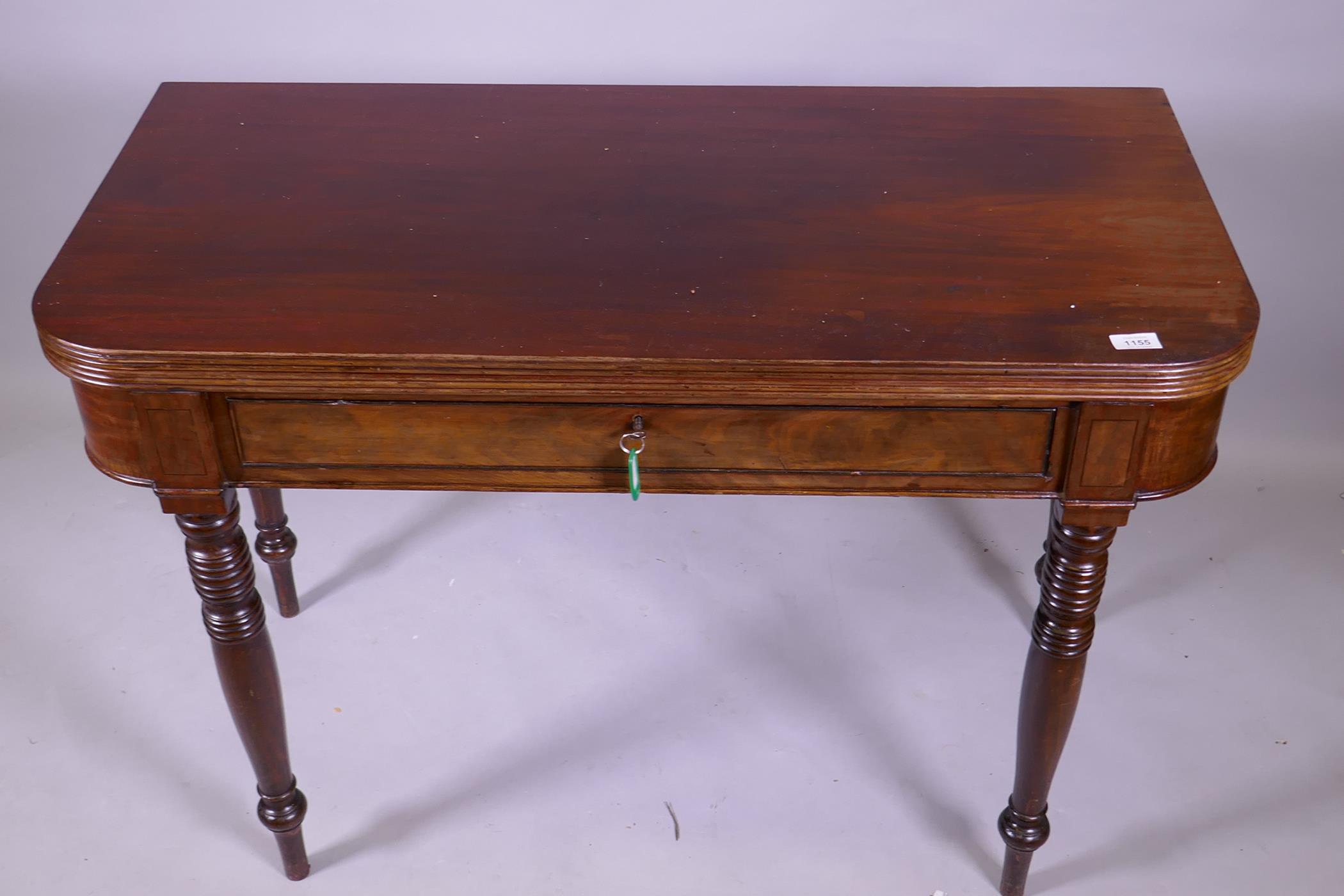 A Georgian mahogany D shaped dining table with reeded edge fold over top, raised on ring turned - Image 2 of 3