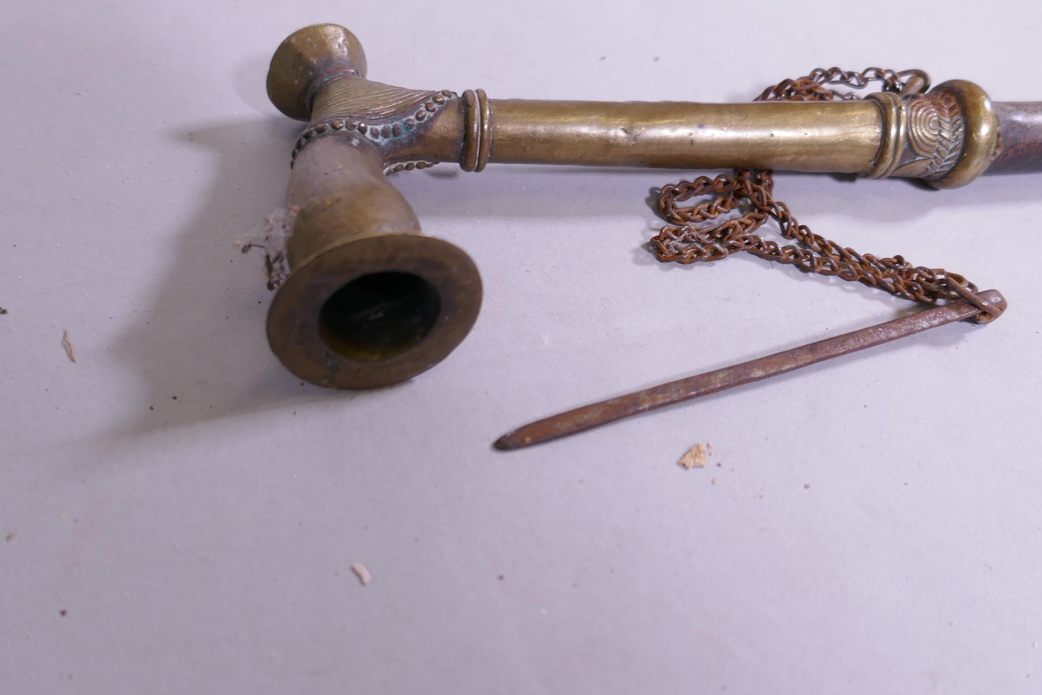 An antique Eastern bras opium pipe with stitched leather shaft, 33cm long - Image 4 of 4