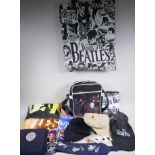 A quantity of Beatles memorabilia including two bags, three Apple Corps caps, Eight Day a Week
