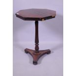 William IV rosewood octagonal top occasional table, raised on a shaped reeded column and platform