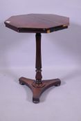 William IV rosewood octagonal top occasional table, raised on a shaped reeded column and platform