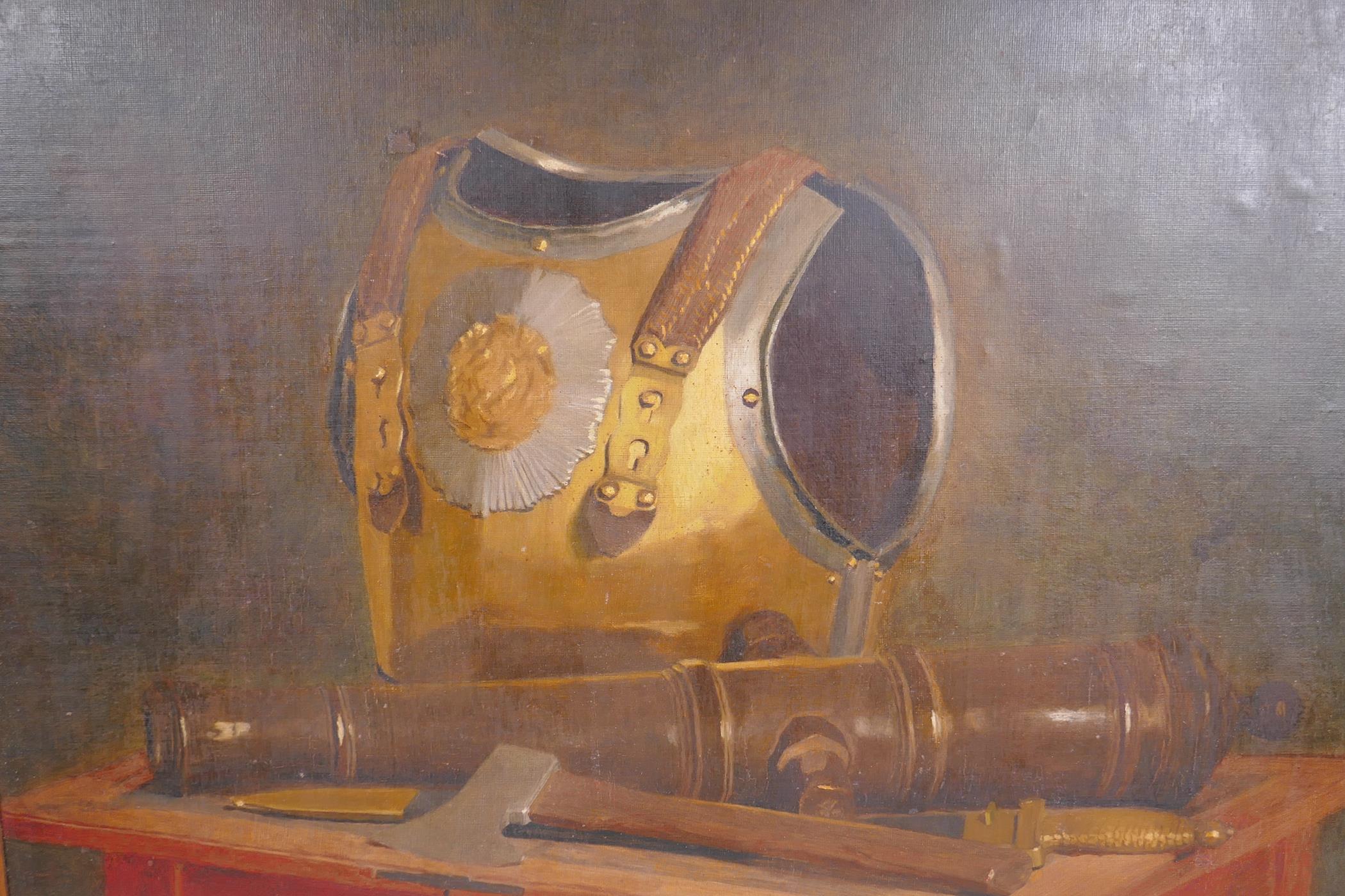 A still life with armour and a cannon, C19th oil on board, 51 x 67cm