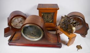 An oak cased mantel clock with brass dial and chiming movement, 29cm high, and two oak cased chiming
