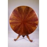 A good C19th tilt top breakfast table, the top with segmented feather grained mahogany veneers,