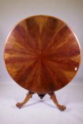 A good C19th tilt top breakfast table, the top with segmented feather grained mahogany veneers,