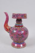 A polychrome wine pourer decorated with the eight Buddhist treasures on a pink ground, Chinese