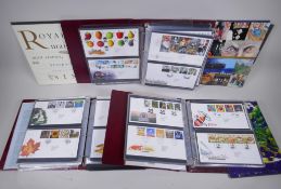 Three albums of First Day covers, and various Royal Mail Mint stamp year packs