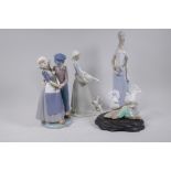 A Lladro figure group, a Nao figure and two Spanish porcelain figures, largest 34cm high