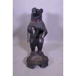 A painted composition Black Forest style bear stick stand, 92cm high