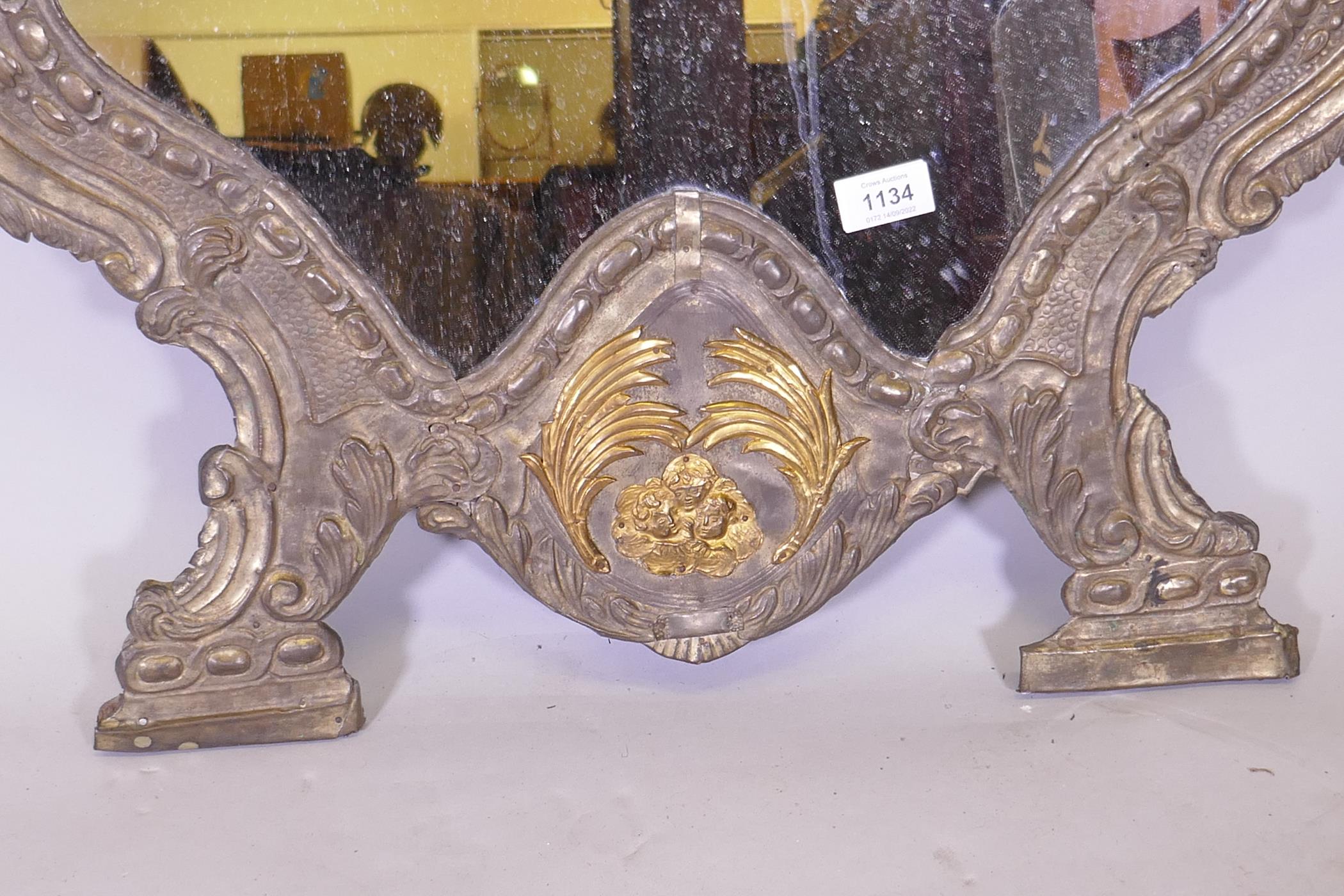 A C19th continental wall mirror, the repousse white metal covers with decorative ormolu mounts, 75cm - Image 3 of 3