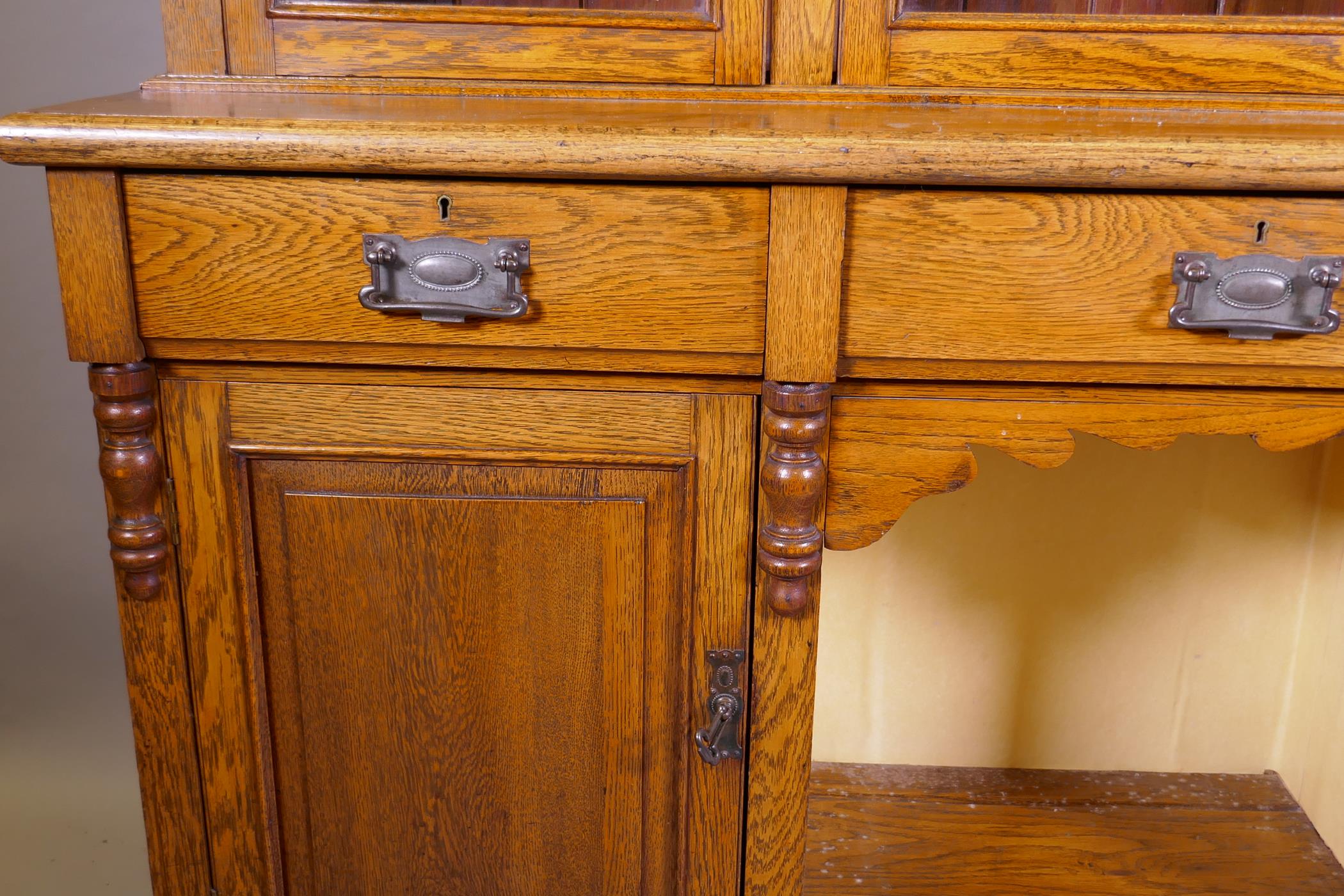 A C19th oak dresser, the upper section with three glazed doors, the base with three drawers over two - Image 2 of 2