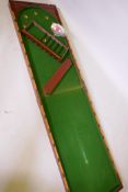 A mahogany cased fold out bagatelle table, 122cm x 63cm x 14cm