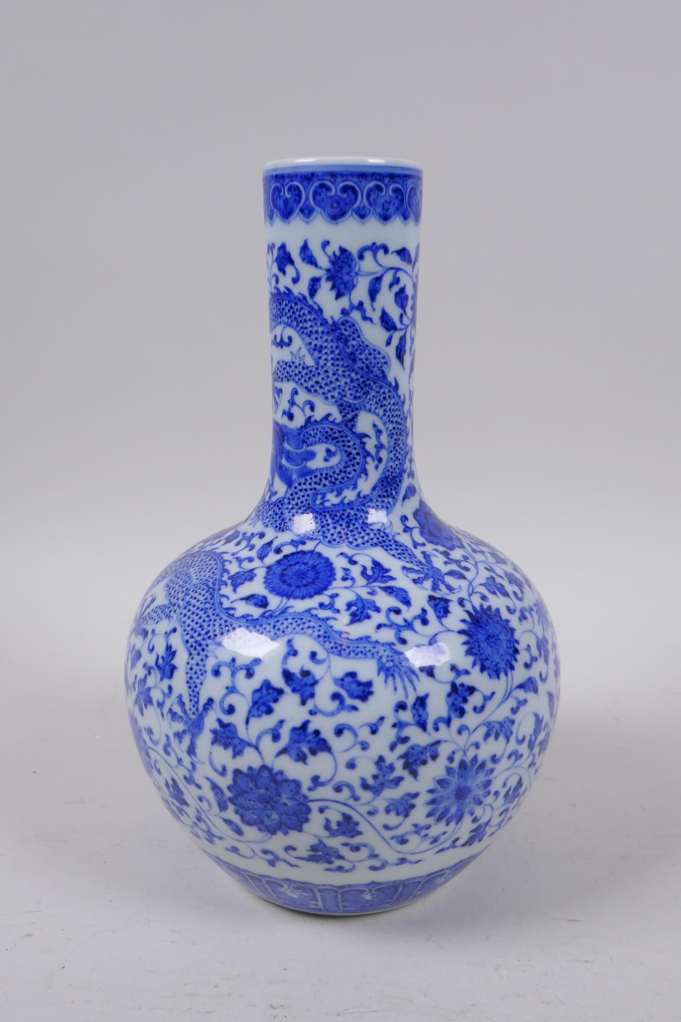 A Chinese blue and white porcelain bottle vase with dragon and lotus flower decoration, Qianlong - Image 3 of 5