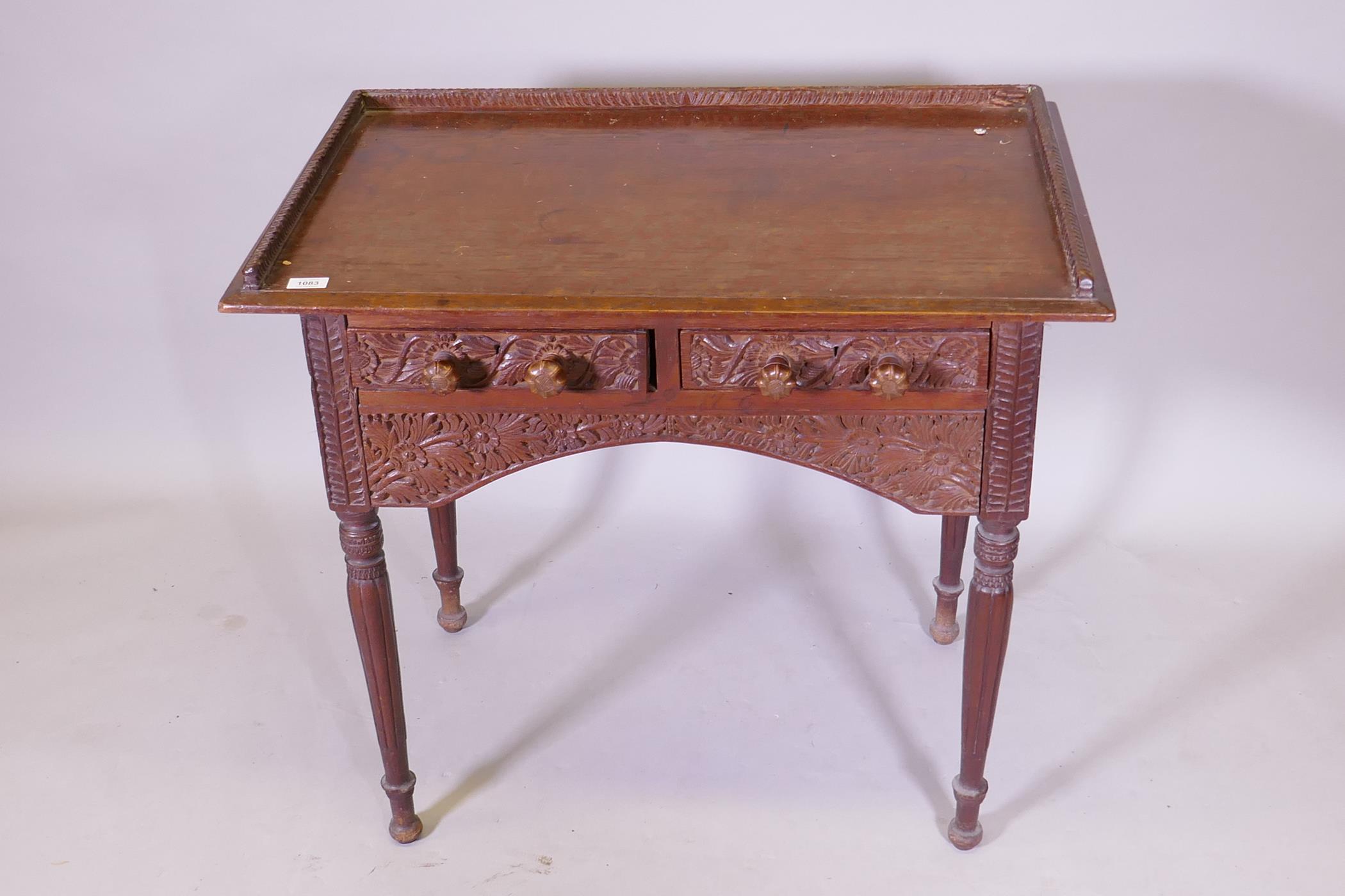 C19th Anglo Indian two drawer padouk writing table with three quarter gallery and carved floral - Image 2 of 4