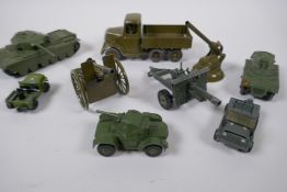 A Britains model six wheel army tipper truck with driver, a Britains Howitzer, two field guns, a