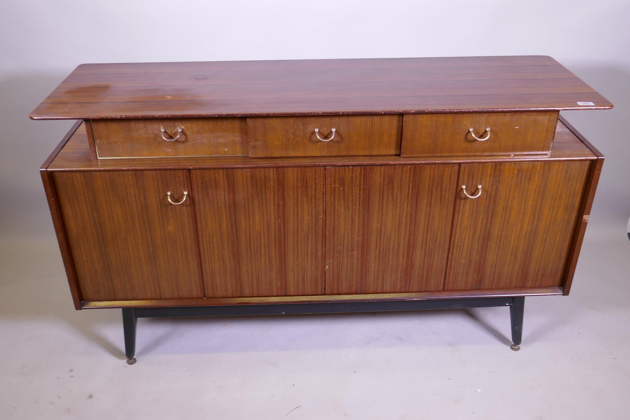 A mid century G-Plan Librenza tola sideboard raised on ebonised supports, 150 x 46 x 86cm - Image 2 of 3