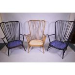 A pair of vintage Ercol stained beech 'Evergreen' armchairs, and another in a natural finish, one
