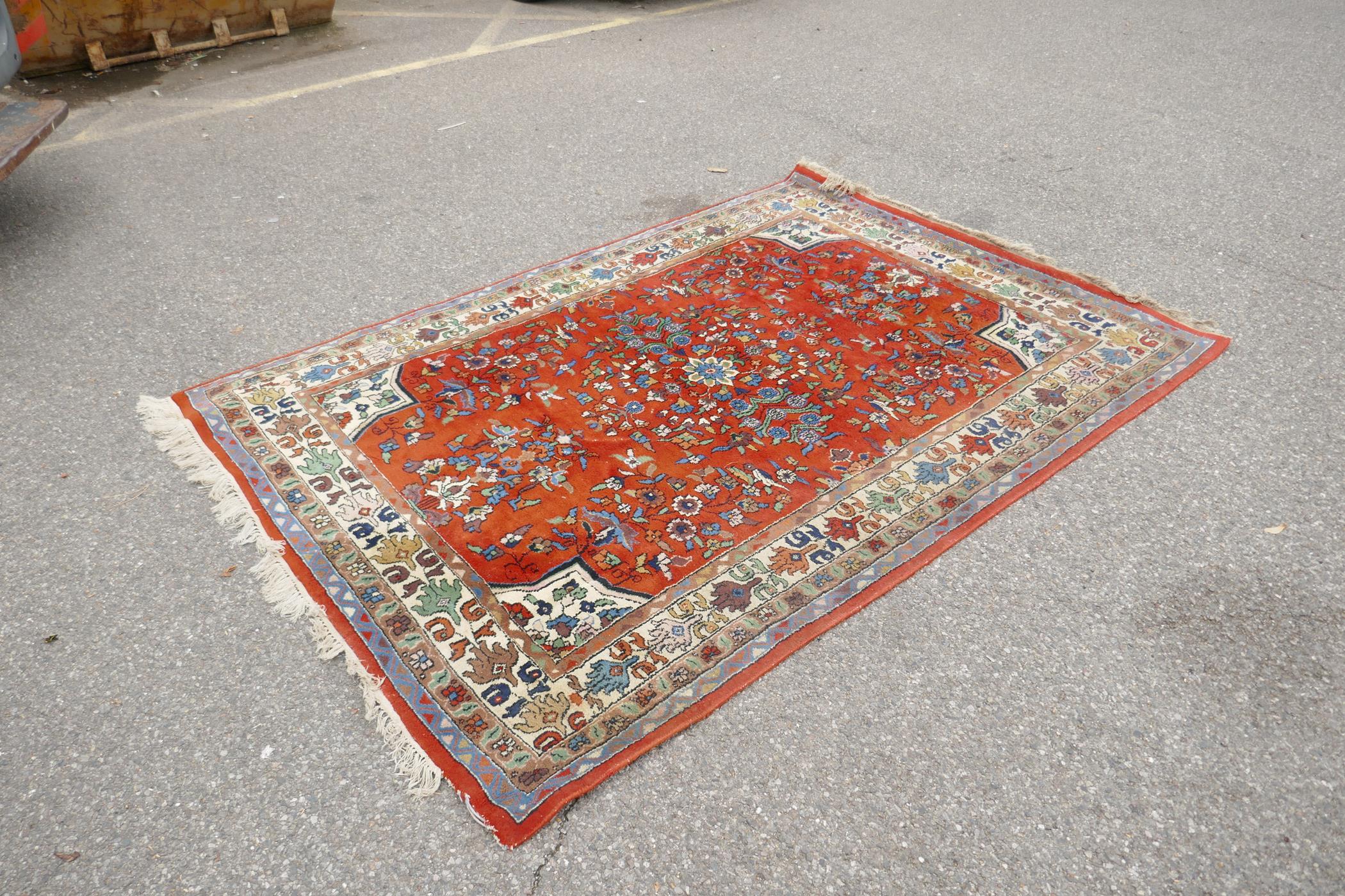 An eastern red ground hand woven wool carpet decorated with a multicolour flower and bird design, - Image 2 of 5
