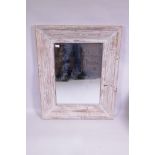 A distressed painted pine wall mirror, 82 x 103cm