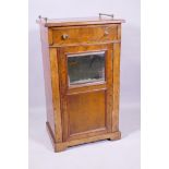 A Victorian burr walnut side cabinet with single drawer over a mirrored door and cupboard with three