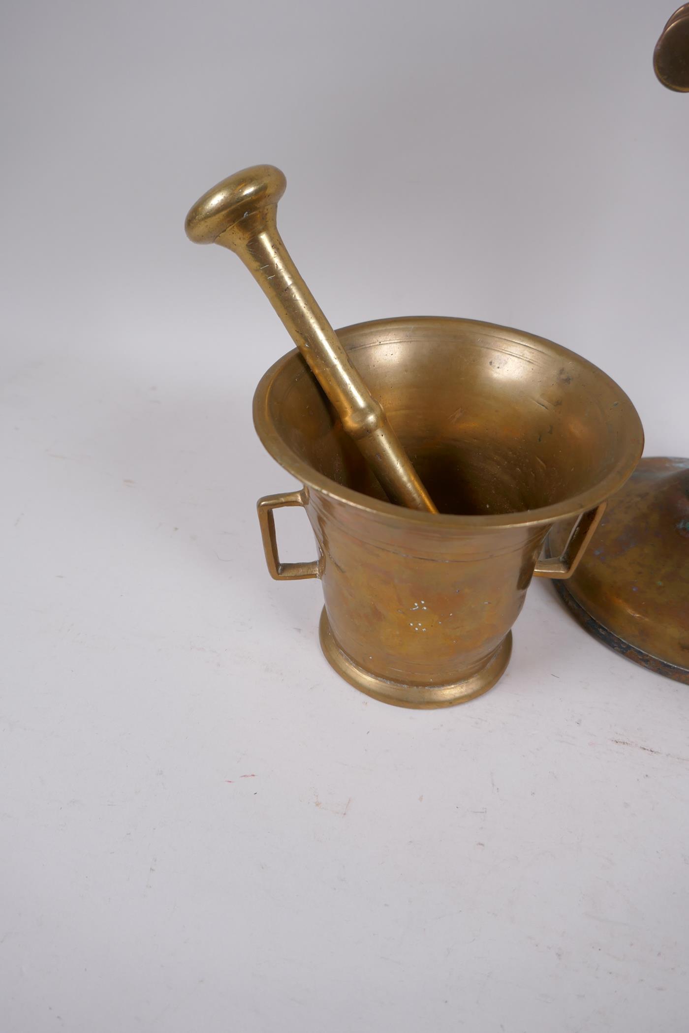 A brass candlestick telephone, AF, 31.5cm high, and two brass mortar and pestles - Image 2 of 4