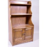 Ercol elm waterfall open bookcase with two shelves and cupboards under, 61 x 35 x 111cm