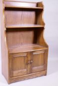 Ercol elm waterfall open bookcase with two shelves and cupboards under, 61 x 35 x 111cm