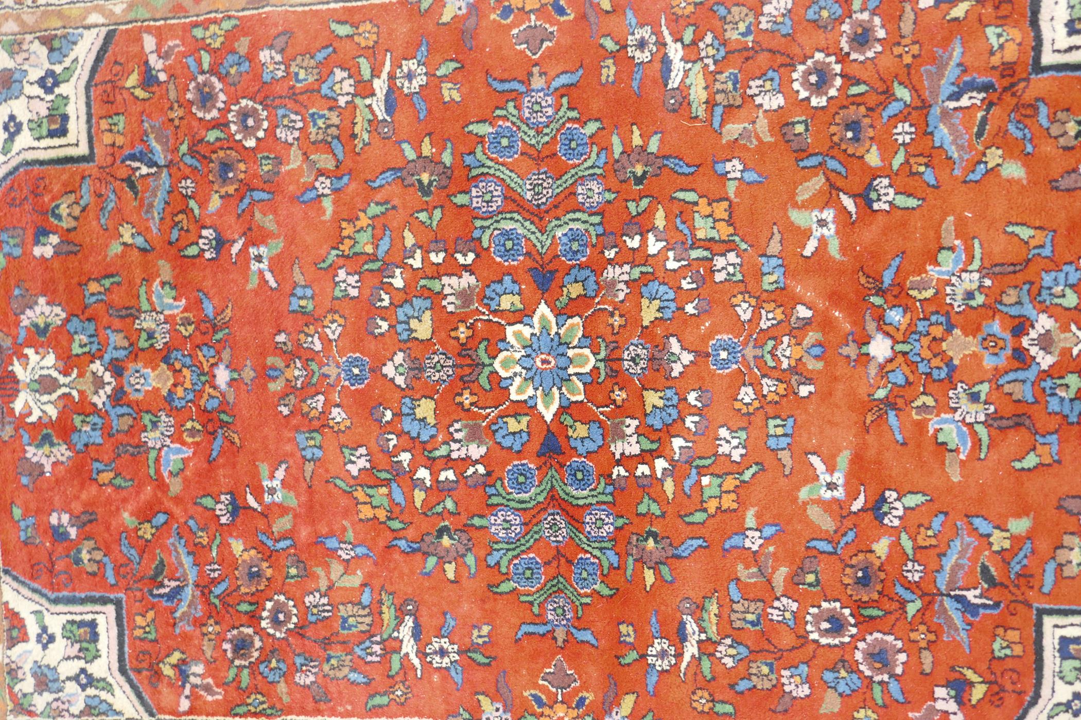 An eastern red ground hand woven wool carpet decorated with a multicolour flower and bird design, - Image 3 of 5