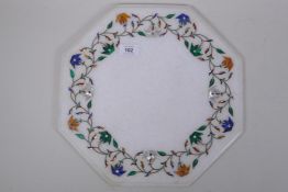 An Indian hexagonal  shaped marble top inlaid with lapiz lazuli, malachite, agate and mother of